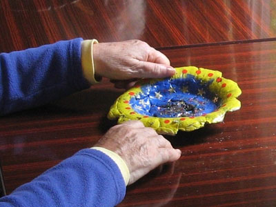 A hand-painted clay bowl made by one of the workshop participants.